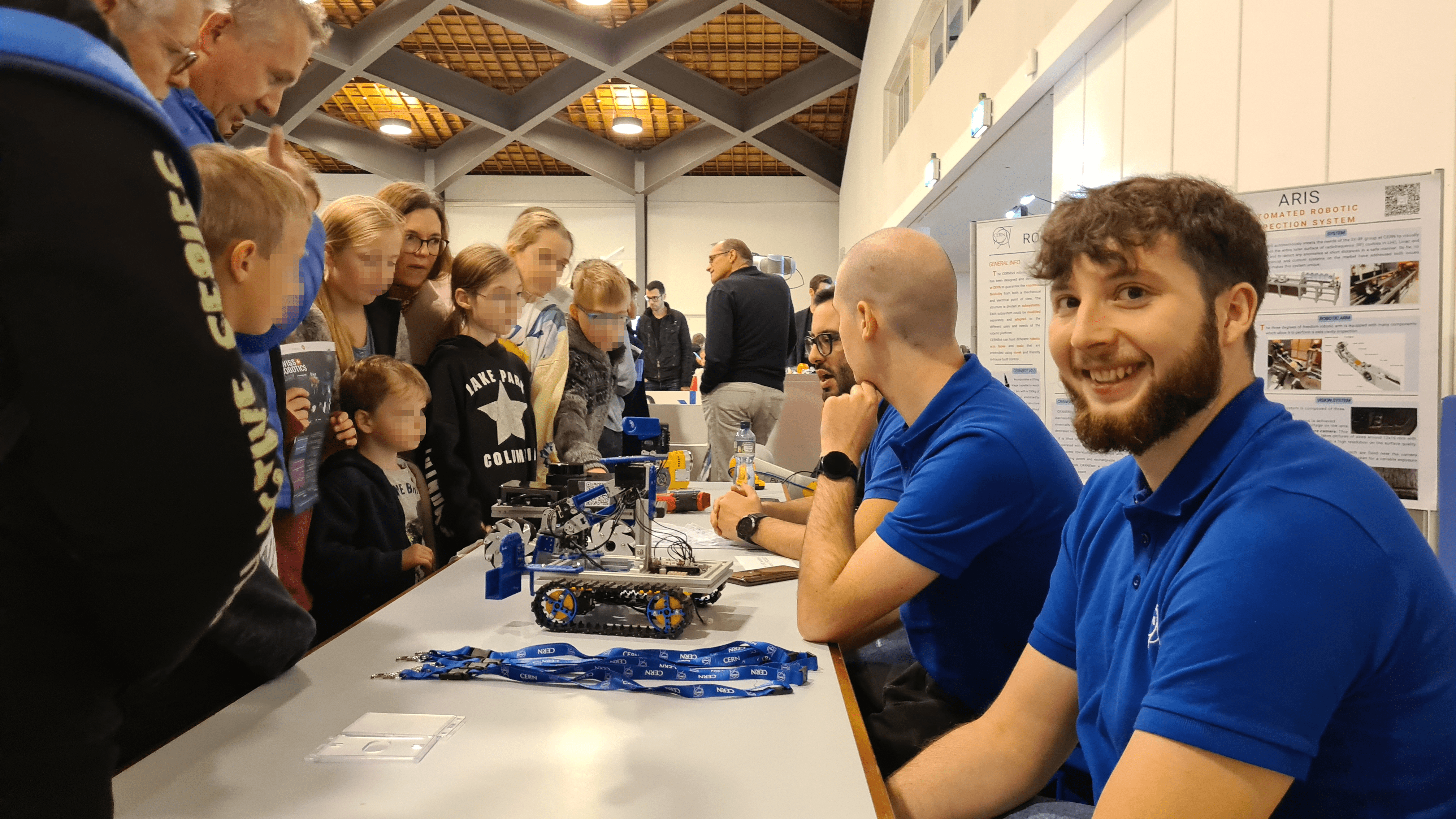 The CERN CEM booth with robots and posters on display